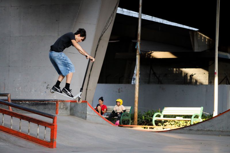 Rider at a skatepark ready to drop in