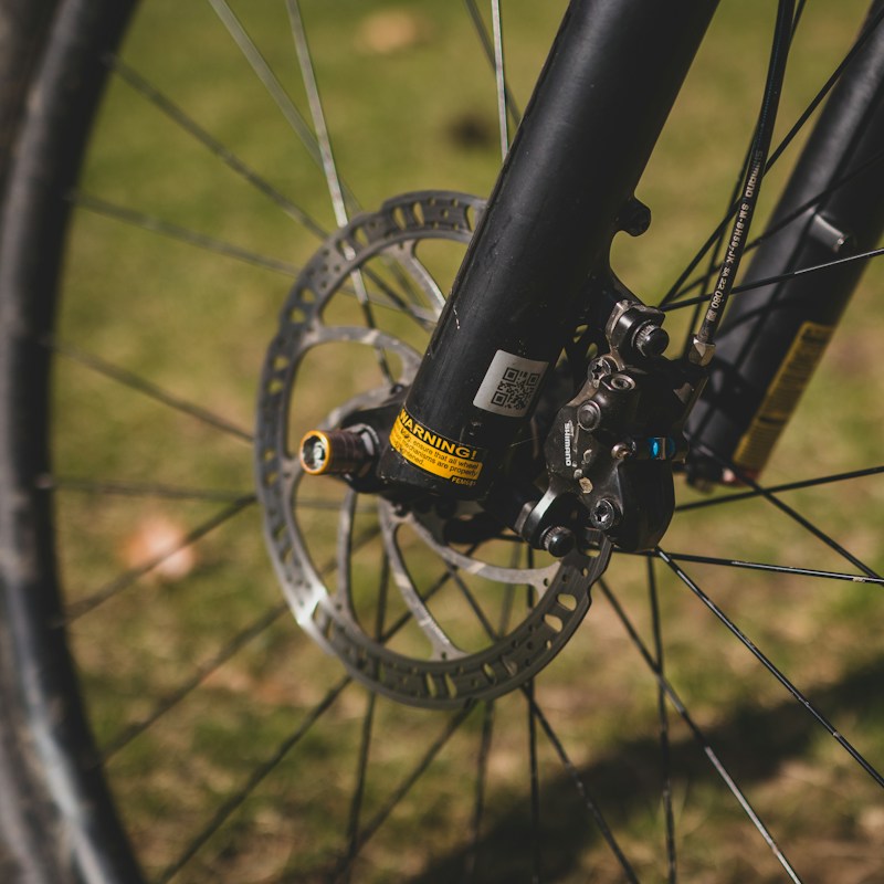 Mountain bike front fork and disc brake close-up